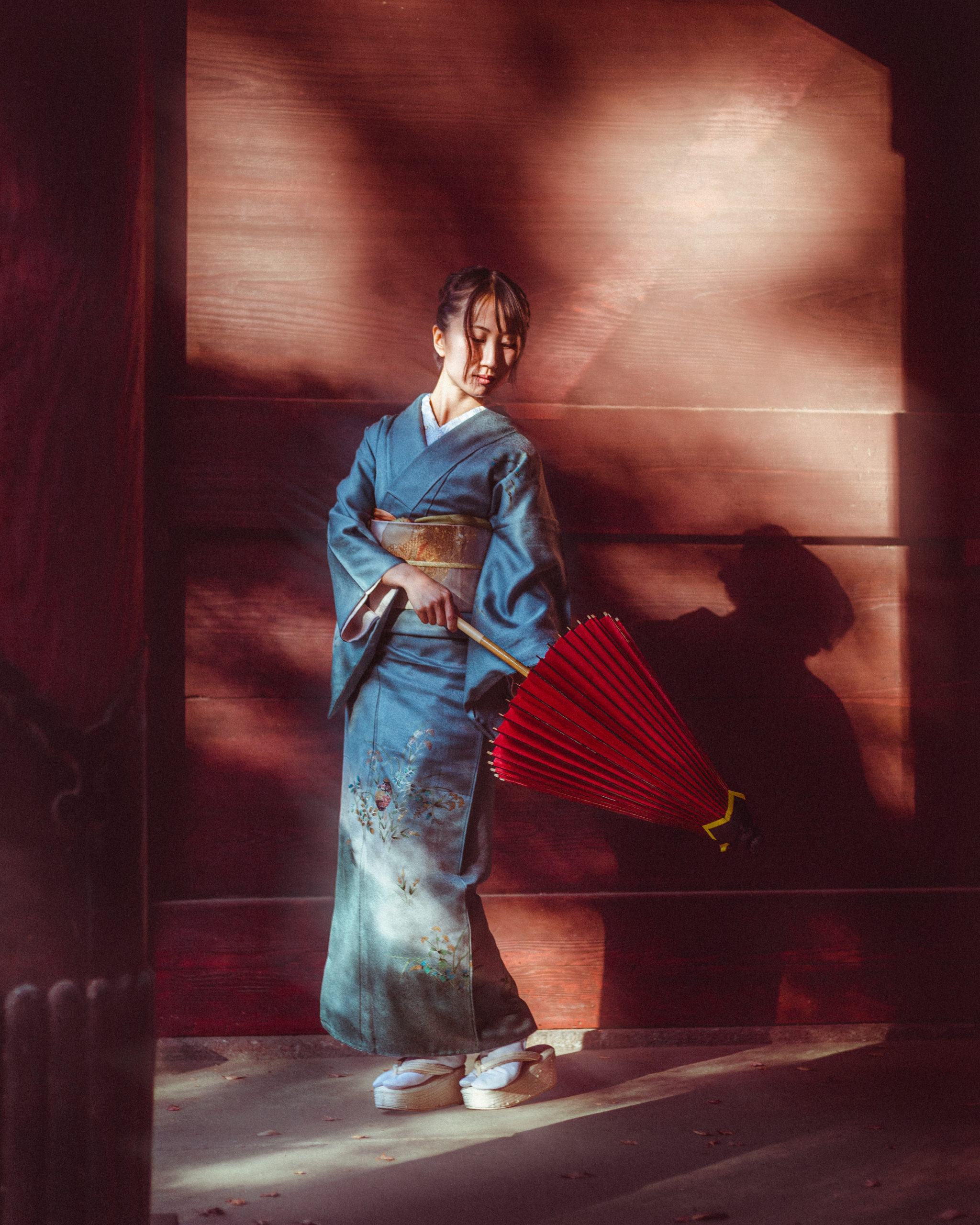 Close-up portrait of woman wearing silk kimono during photoshoot in Kamakura