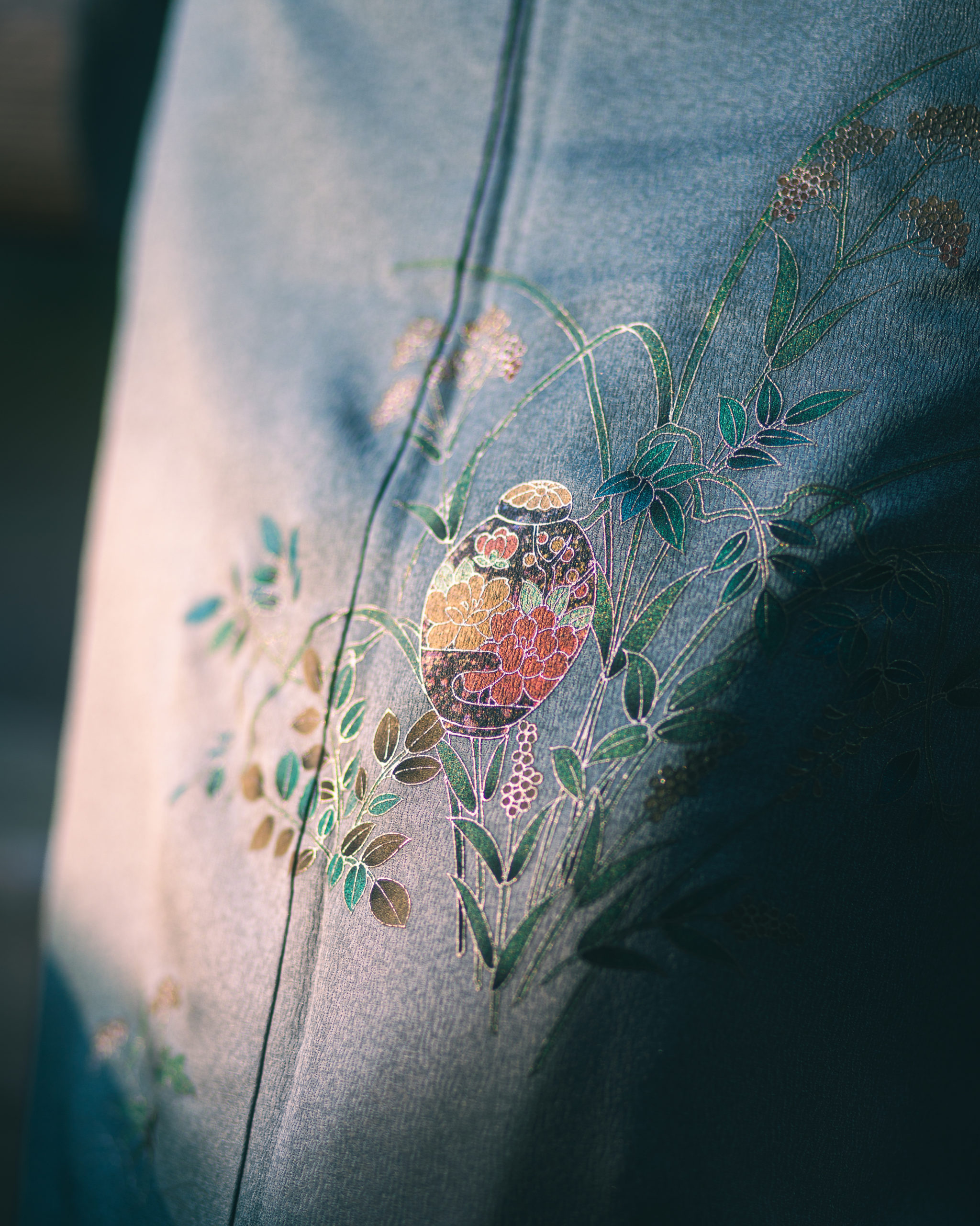 Hand-painted detail of tsukesage silk kimono with autumn botanical motif