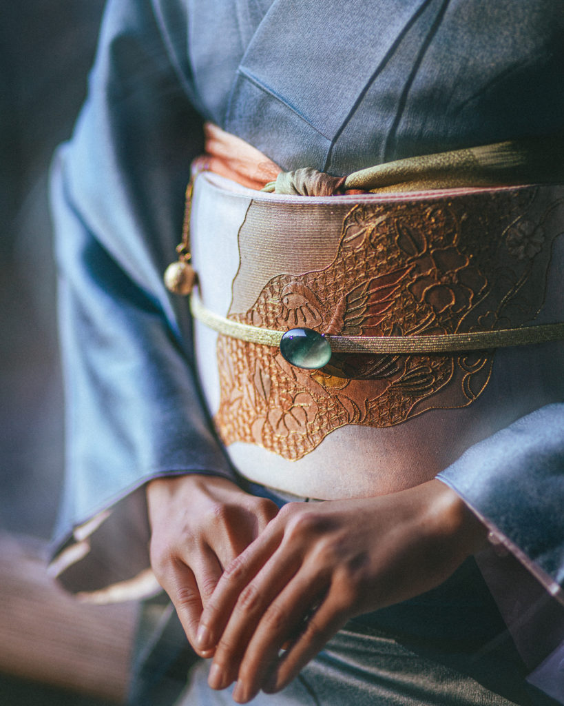 Close-up of fukuro obi with embroidery on silk kimono during photoshoot in Kamakura
